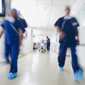 Medical team and patient moving towards operating room before surgery